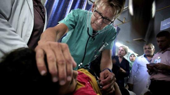 Mads Gilbert with Gaza patient